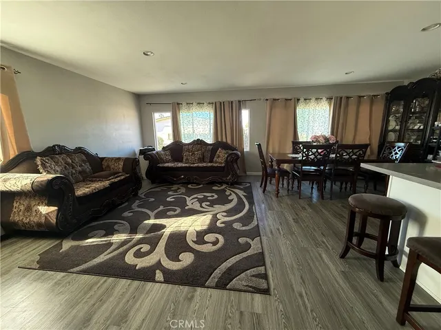 a view of a dining room with furniture and window