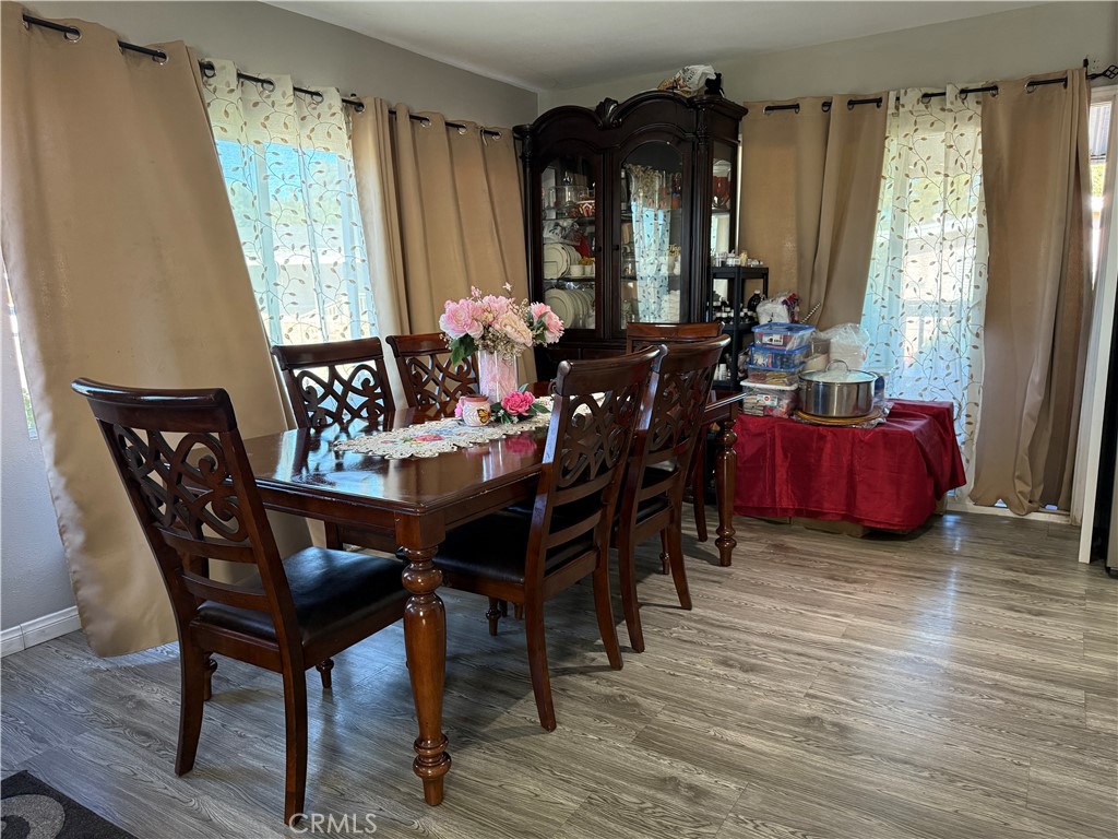 2601 East Victoria Street, Unit 404 Compton, CA 90220 - Photo 10 of 30 a view of a dining room with furniture and window