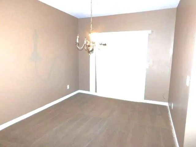 a kitchen with a refrigerator and a stove