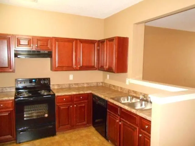 a white toilet sitting next to a shower