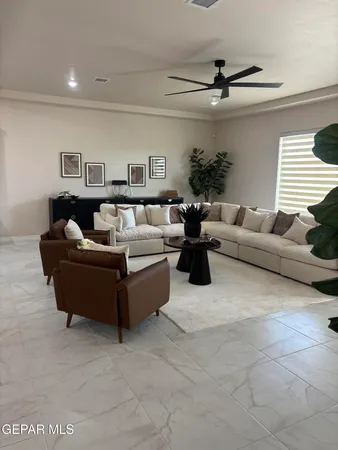 a living room with furniture and a window