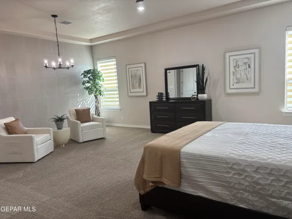 a bedroom with bed and window