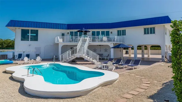 a view of a house with swimming pool