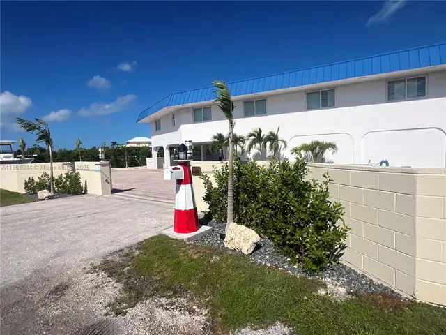a view of a parking area and a car parked