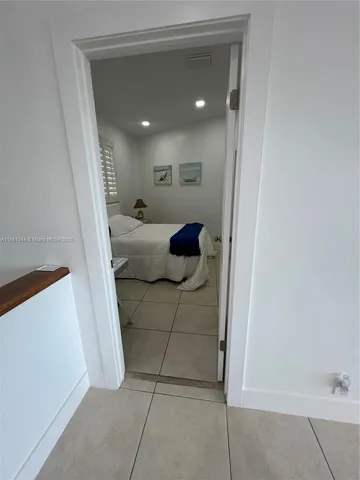 a bed room with a bed and a window