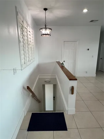 a utility room with cabinets washer and dryer