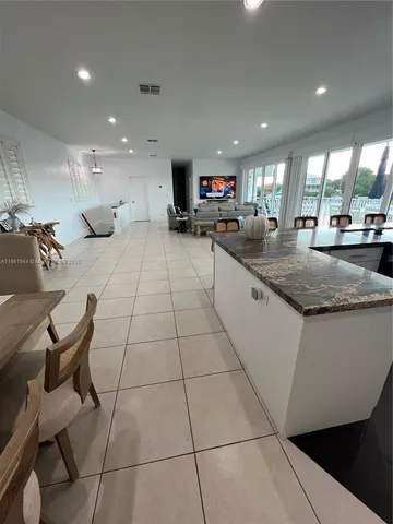 a utility room with cabinets washer and dryer