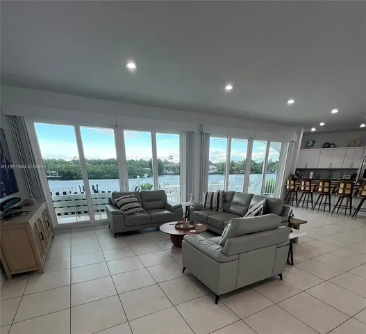 a living room with a couch and white walls