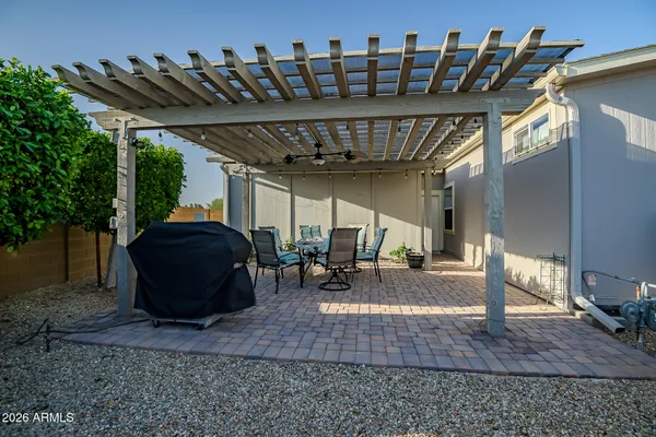 a view of a chairs and table in the patio