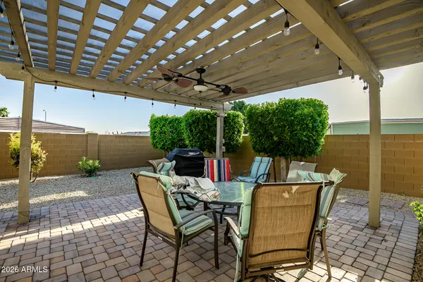 a view of an outdoor dining space with furniture