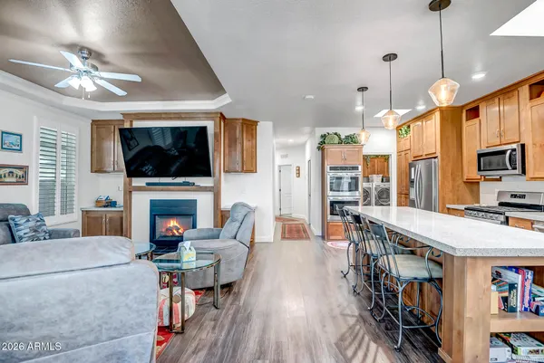 a living room with fireplace furniture and a flat screen tv