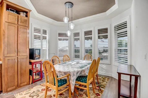 a view of a dining room with furniture window and outside view