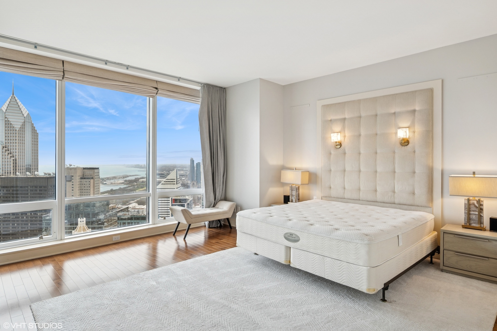401 North Wabash Avenue, Unit 49I Chicago, IL 60611 - Photo 11 of 16 a bedroom with a large bed and a large window