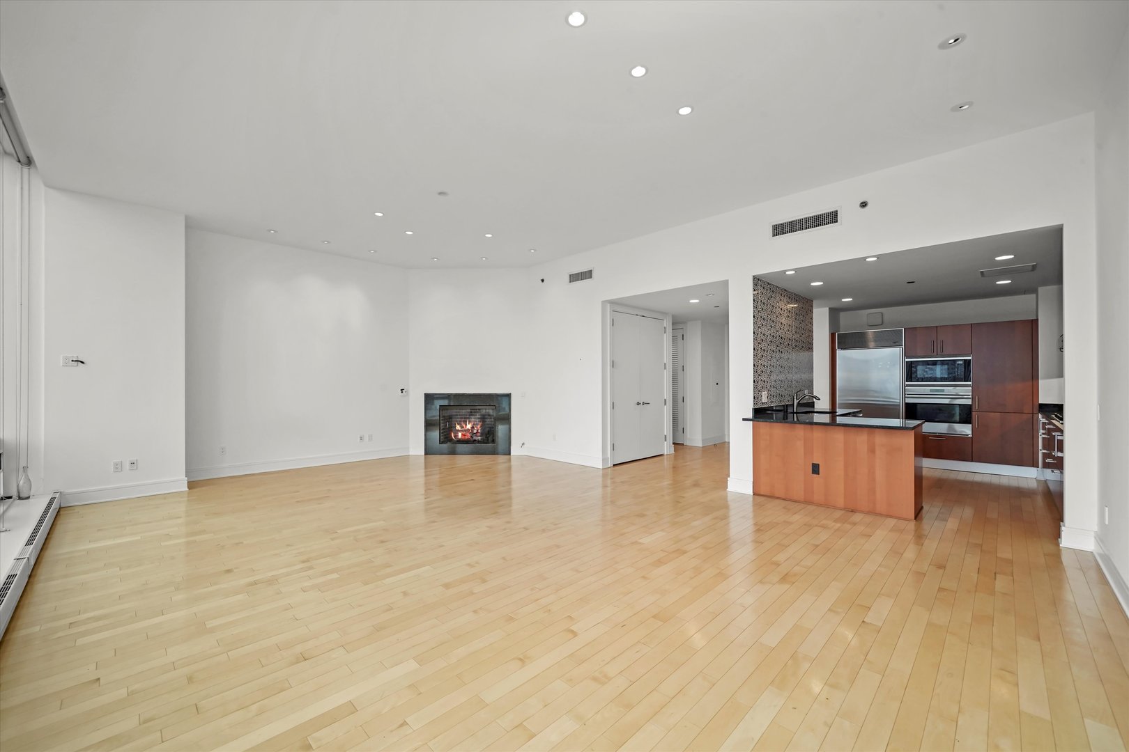 401 North Wabash Avenue, Unit 49I Chicago, IL 60611 - Photo 4 of 16 a view of kitchen with kitchen island and stainless steel appliances