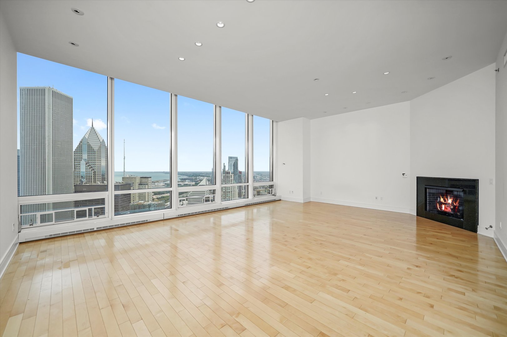 401 North Wabash Avenue, Unit 49I Chicago, IL 60611 - Photo 6 of 16 a view of an empty room with a fireplace