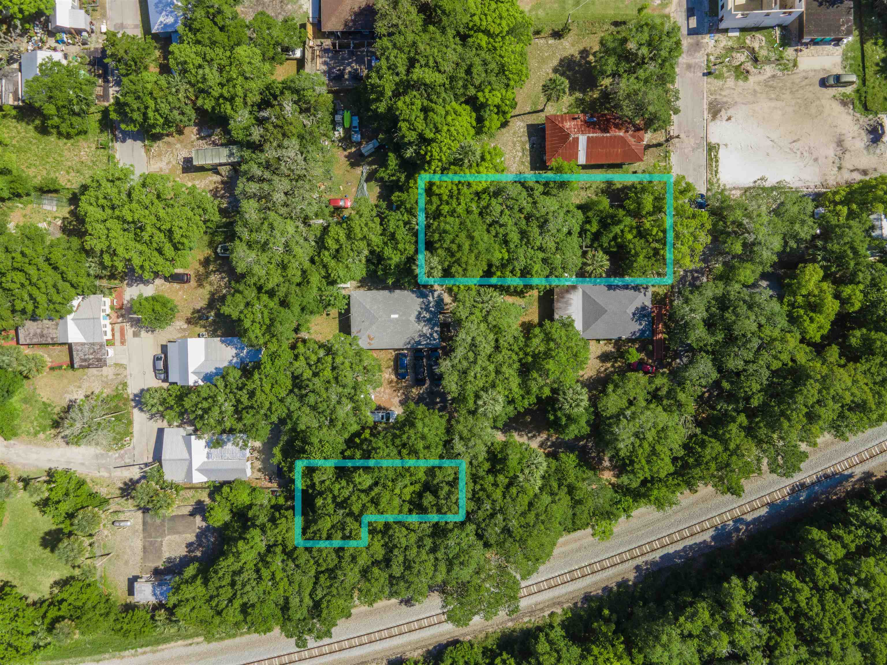 7 North Whitney Street St. Augustine, FL 32084 - Photo 10 of 10 an aerial view of a house with a yard and lake view