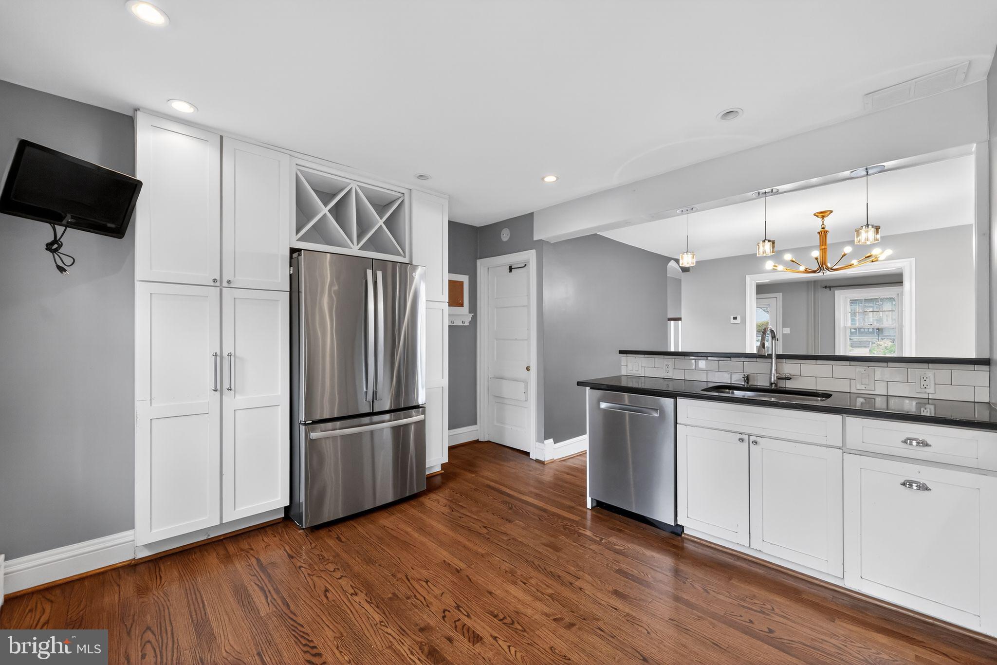 522 Dudley Avenue Narberth, PA 19072 - Photo 22 of 40 a kitchen with stainless steel appliances granite countertop a refrigerator and a sink
