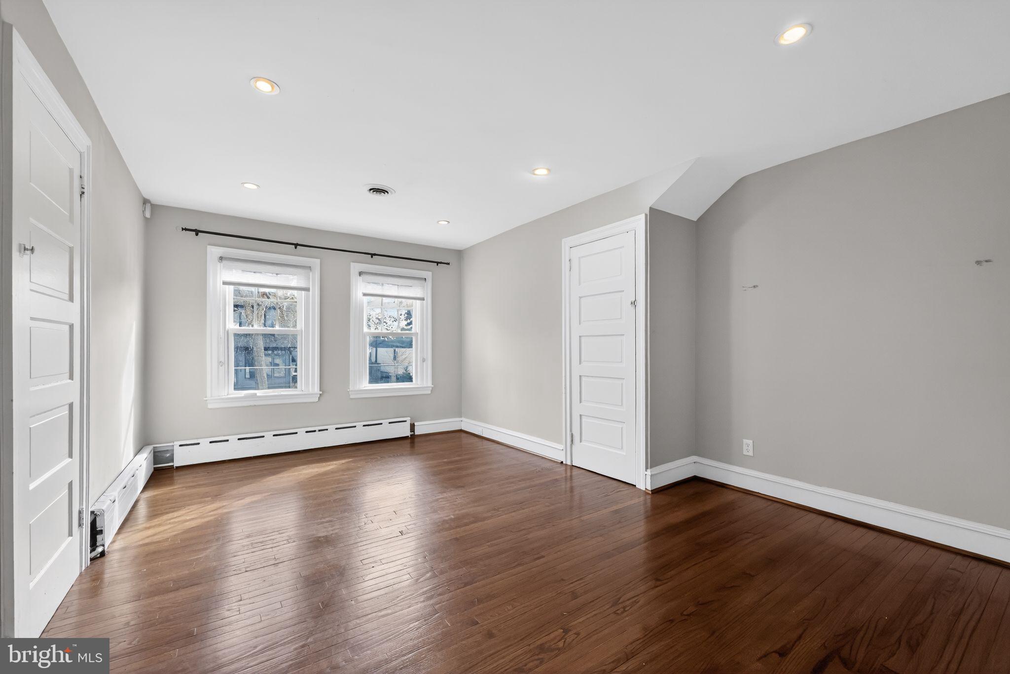 522 Dudley Avenue Narberth, PA 19072 - Photo 25 of 40 a view of an empty room with wooden floor and a window