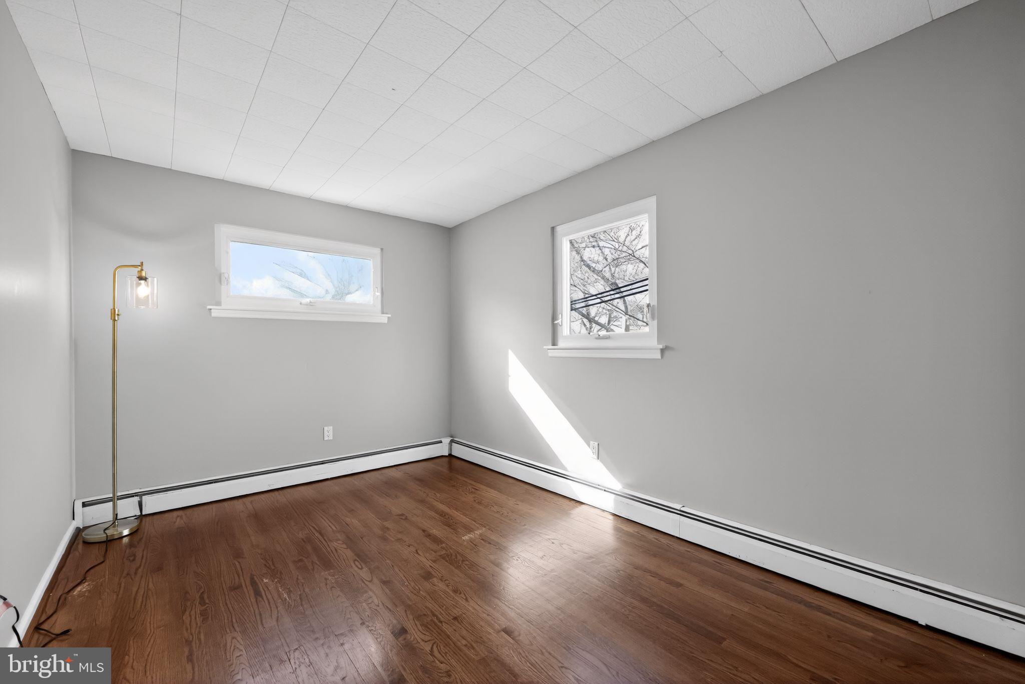 522 Dudley Avenue Narberth, PA 19072 - Photo 32 of 40 an empty room with a hardwood and ceiling fan