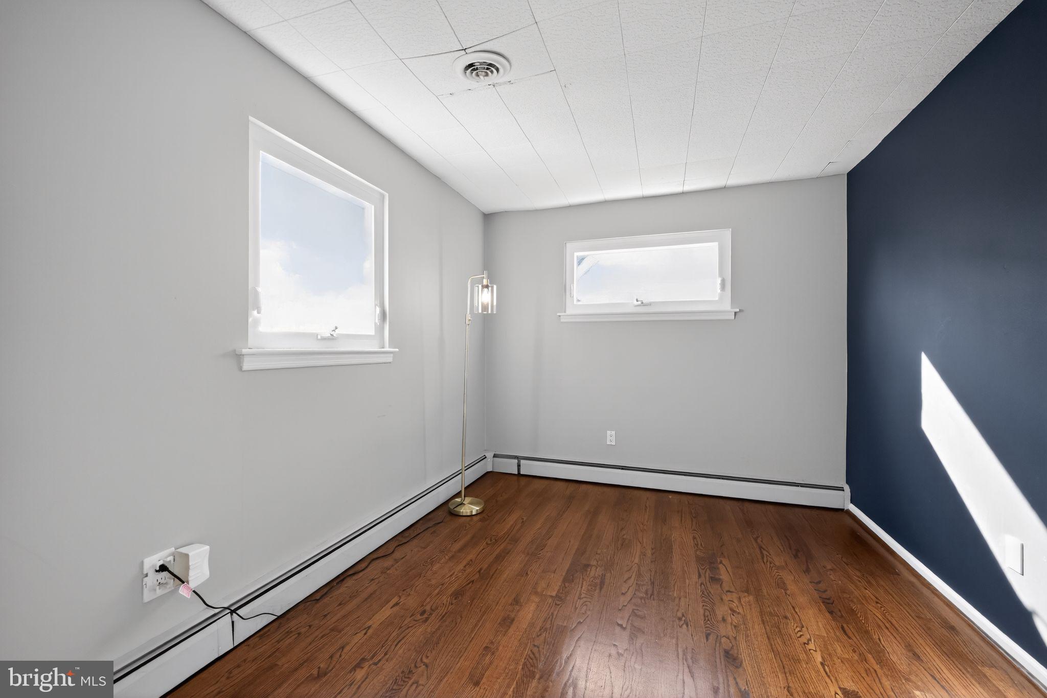 522 Dudley Avenue Narberth, PA 19072 - Photo 34 of 40 an empty room with wooden floor and windows