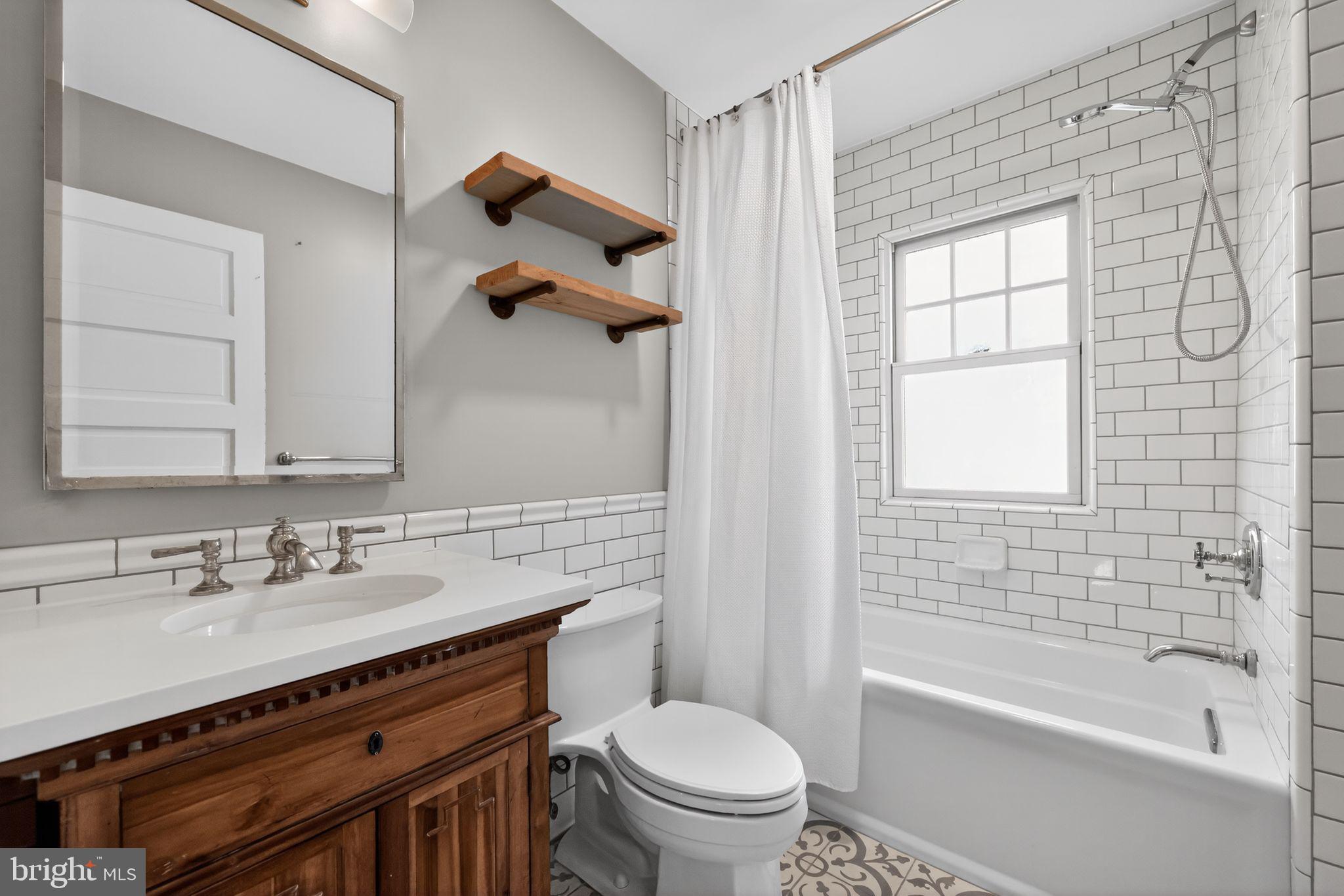 522 Dudley Avenue Narberth, PA 19072 - Photo 35 of 40 a bathroom with a sink a toilet and shower