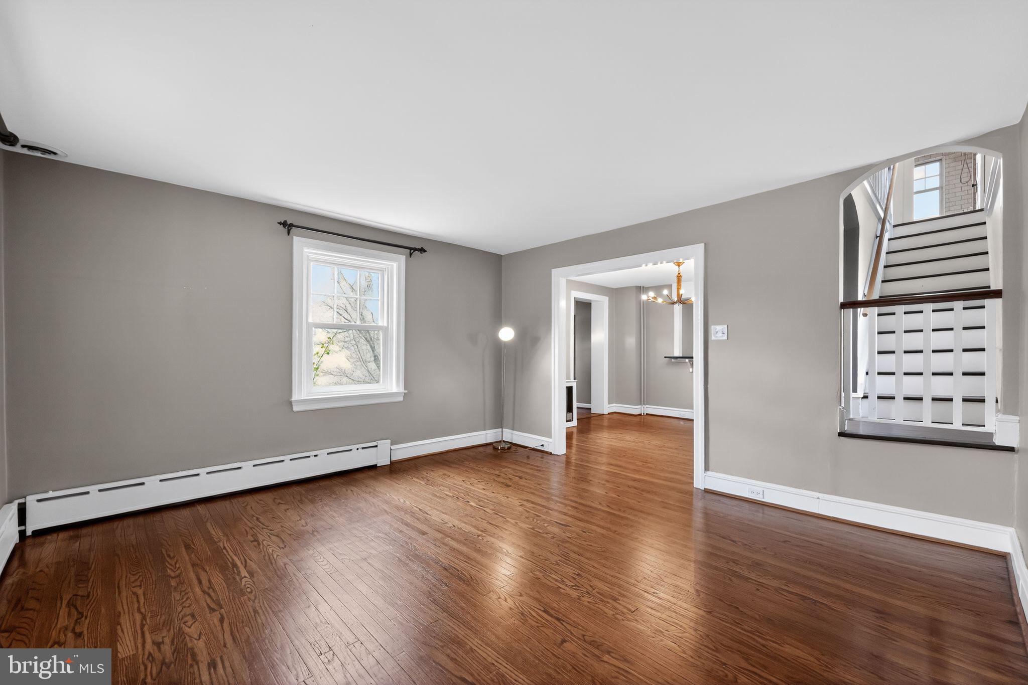 522 Dudley Avenue Narberth, PA 19072 - Photo 6 of 40 an empty room with wooden floor and windows