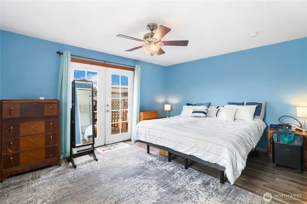 a bedroom with a bed and a dresser