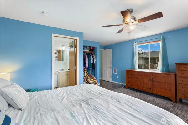 a bed room with a bed and a window