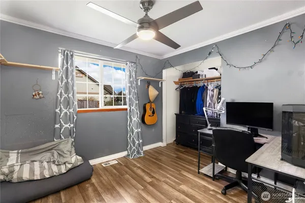 a bedroom with furniture and a window