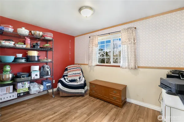a room with wooden floor and furniture