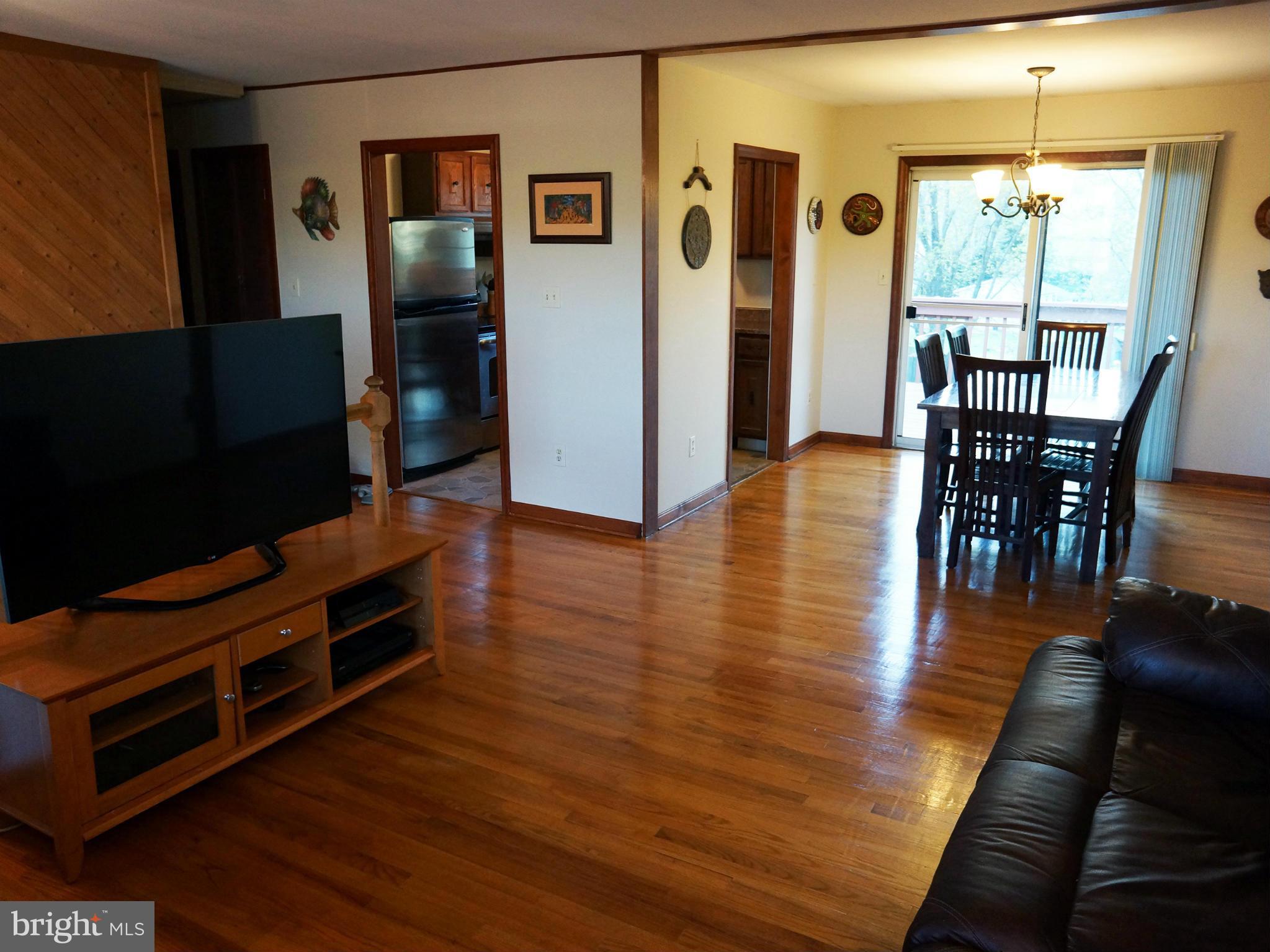 2614 Neudecker Road Westminster, MD 21157 - Photo 11 of 26 a living room with furniture wooden floor and a table