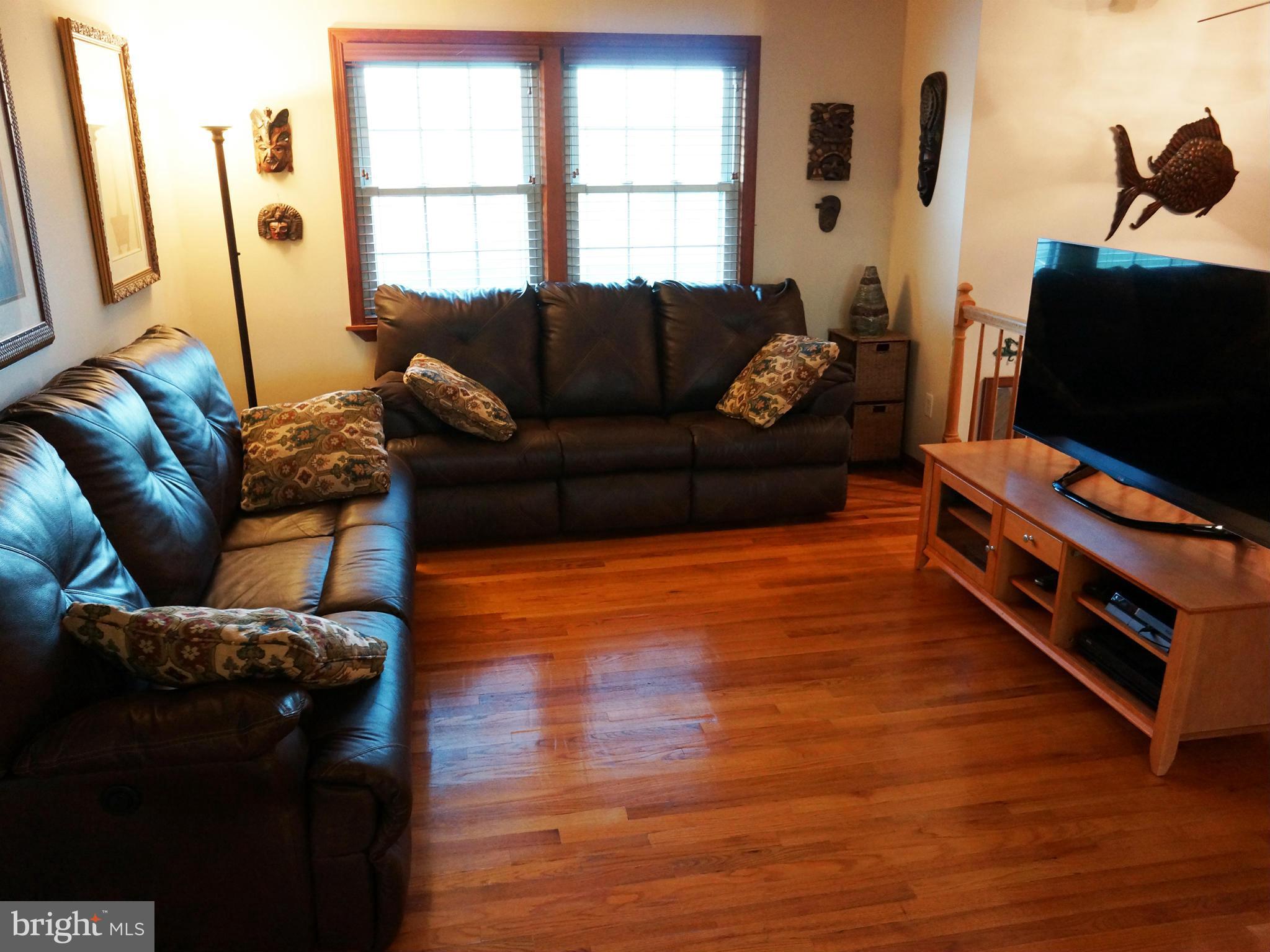 2614 Neudecker Road Westminster, MD 21157 - Photo 13 of 26 a living room with furniture and a flat screen tv