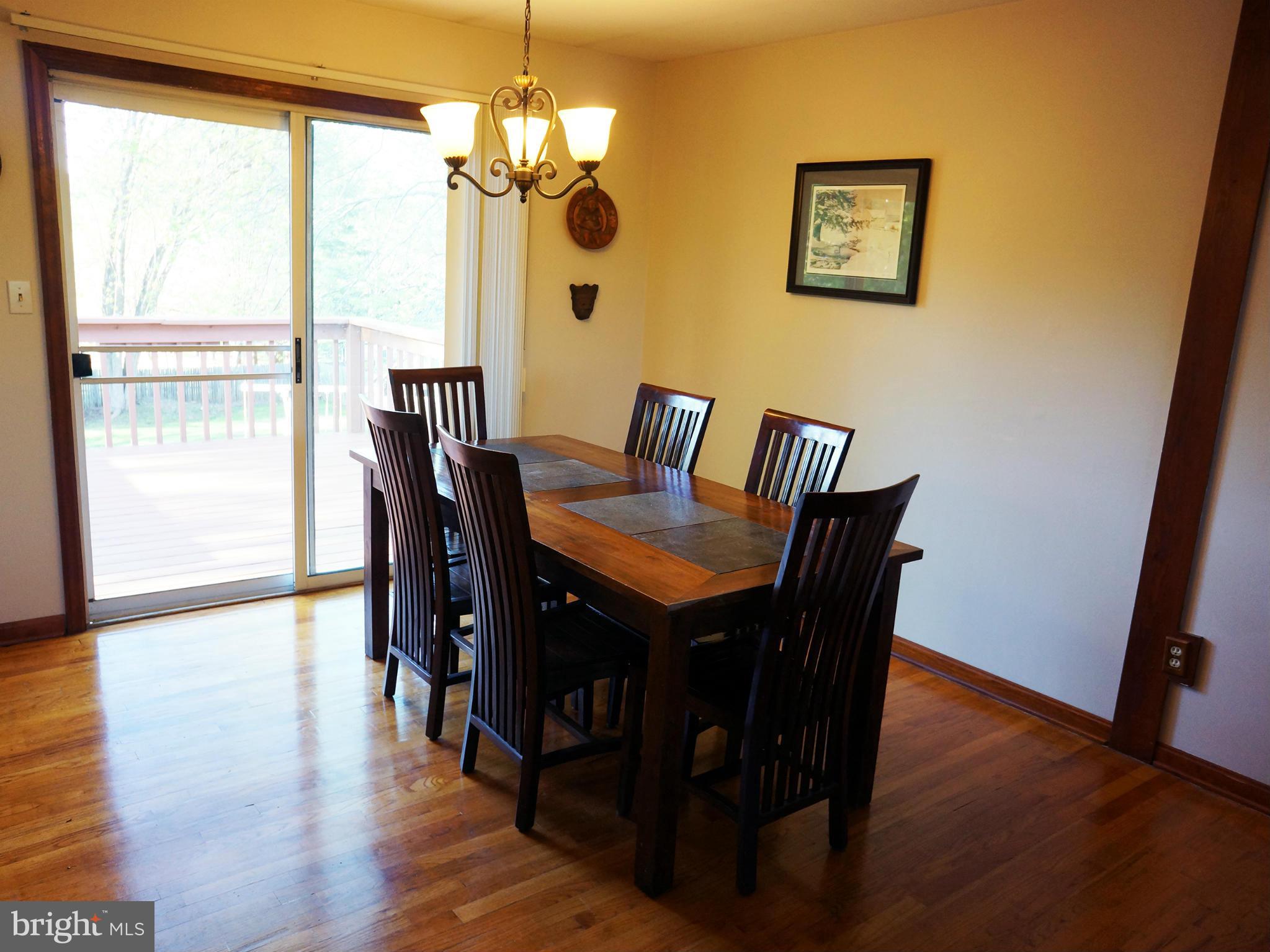 2614 Neudecker Road Westminster, MD 21157 - Photo 14 of 26 a view of a dining room with furniture window and wooden floor
