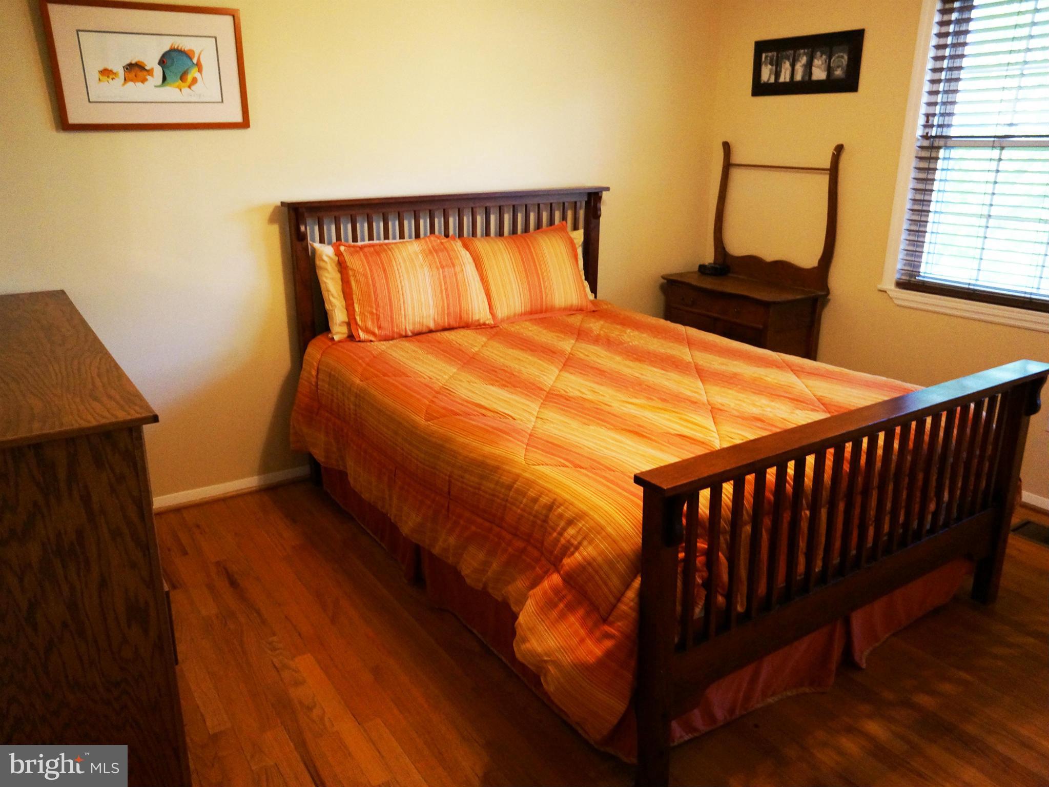 2614 Neudecker Road Westminster, MD 21157 - Photo 16 of 26 a bed sitting in a bedroom next to a window