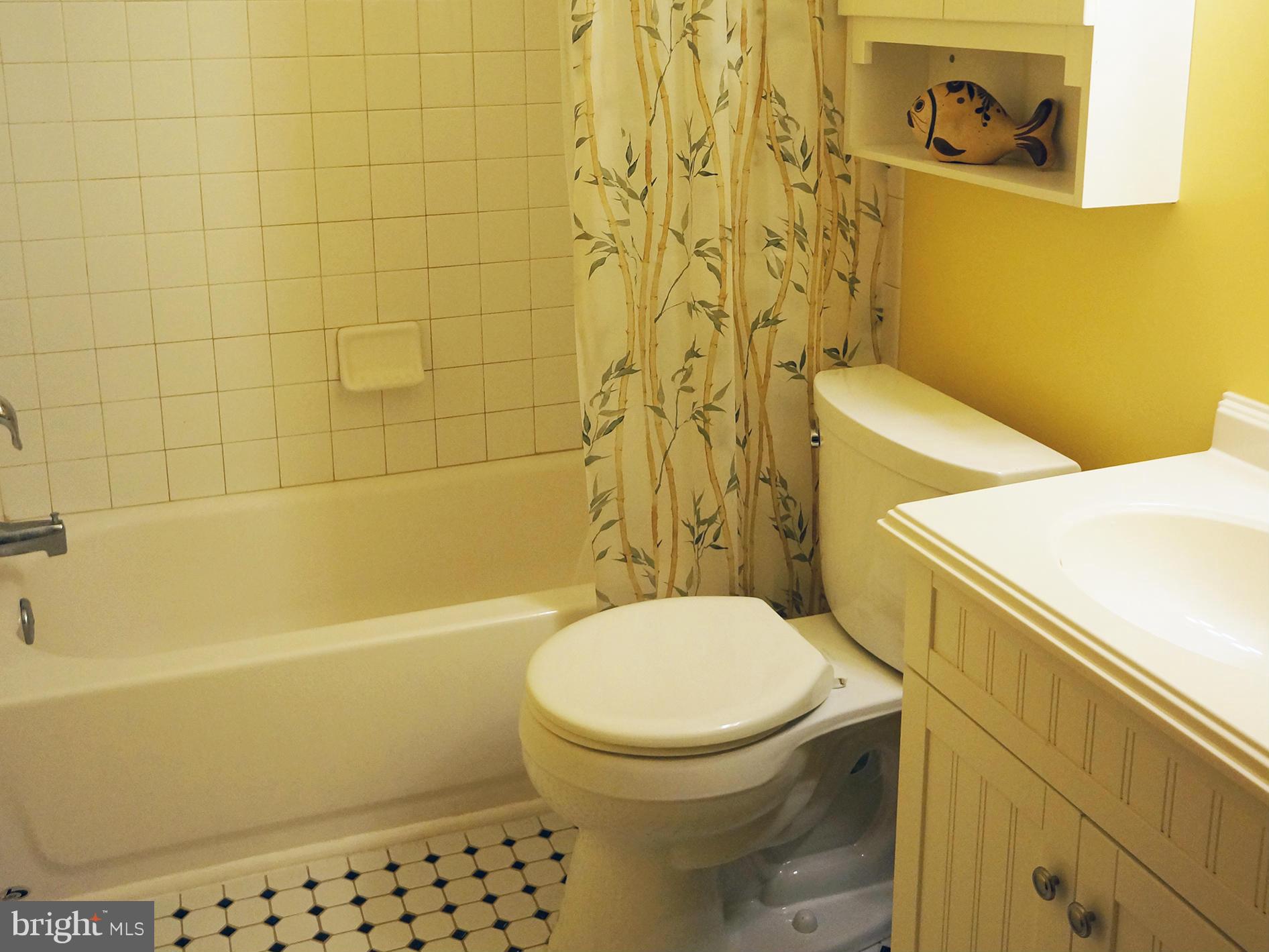 2614 Neudecker Road Westminster, MD 21157 - Photo 18 of 26 a white toilet sitting next to a bath tub