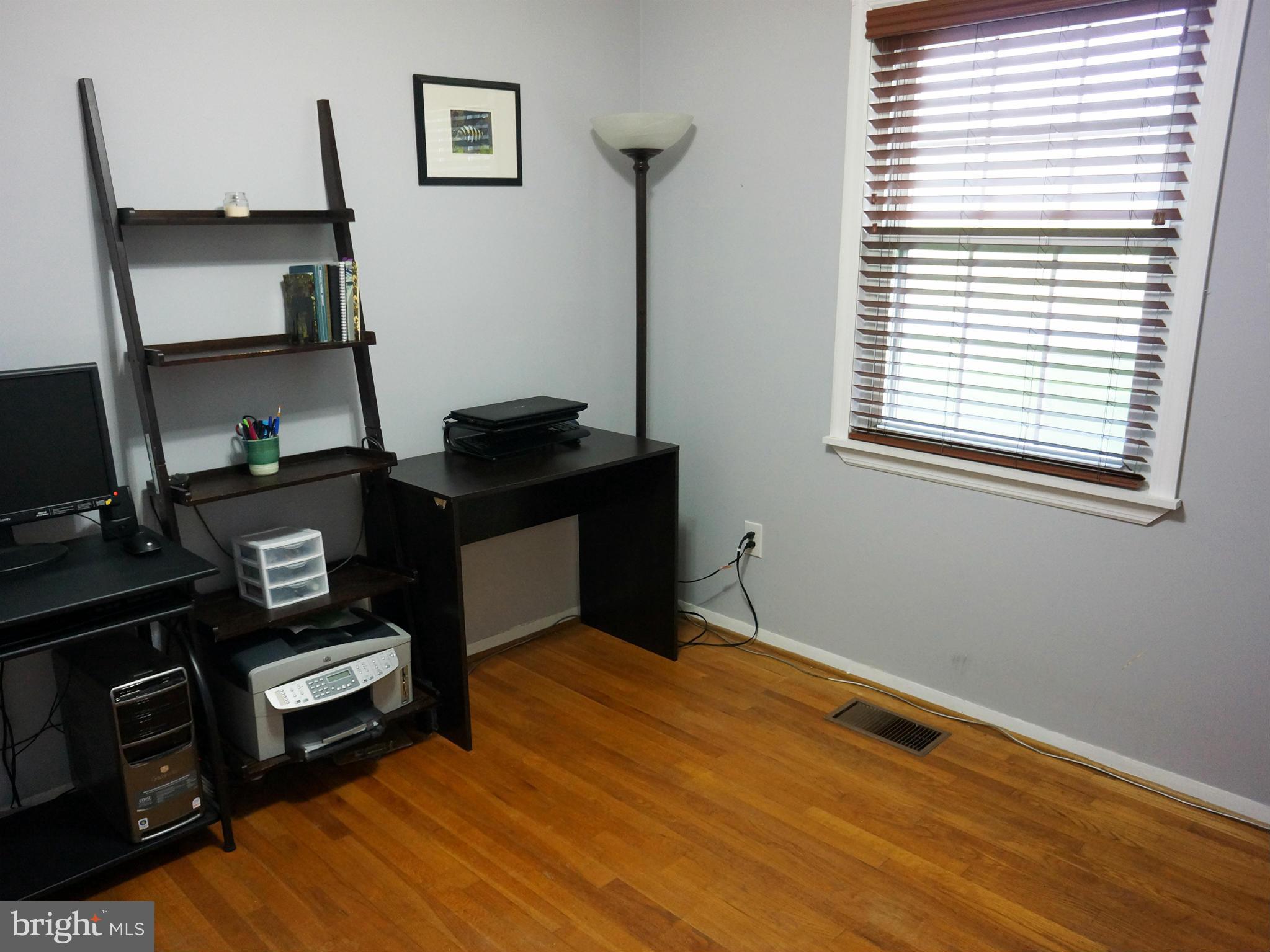 2614 Neudecker Road Westminster, MD 21157 - Photo 20 of 26 a bedroom with a bed and wooden floor