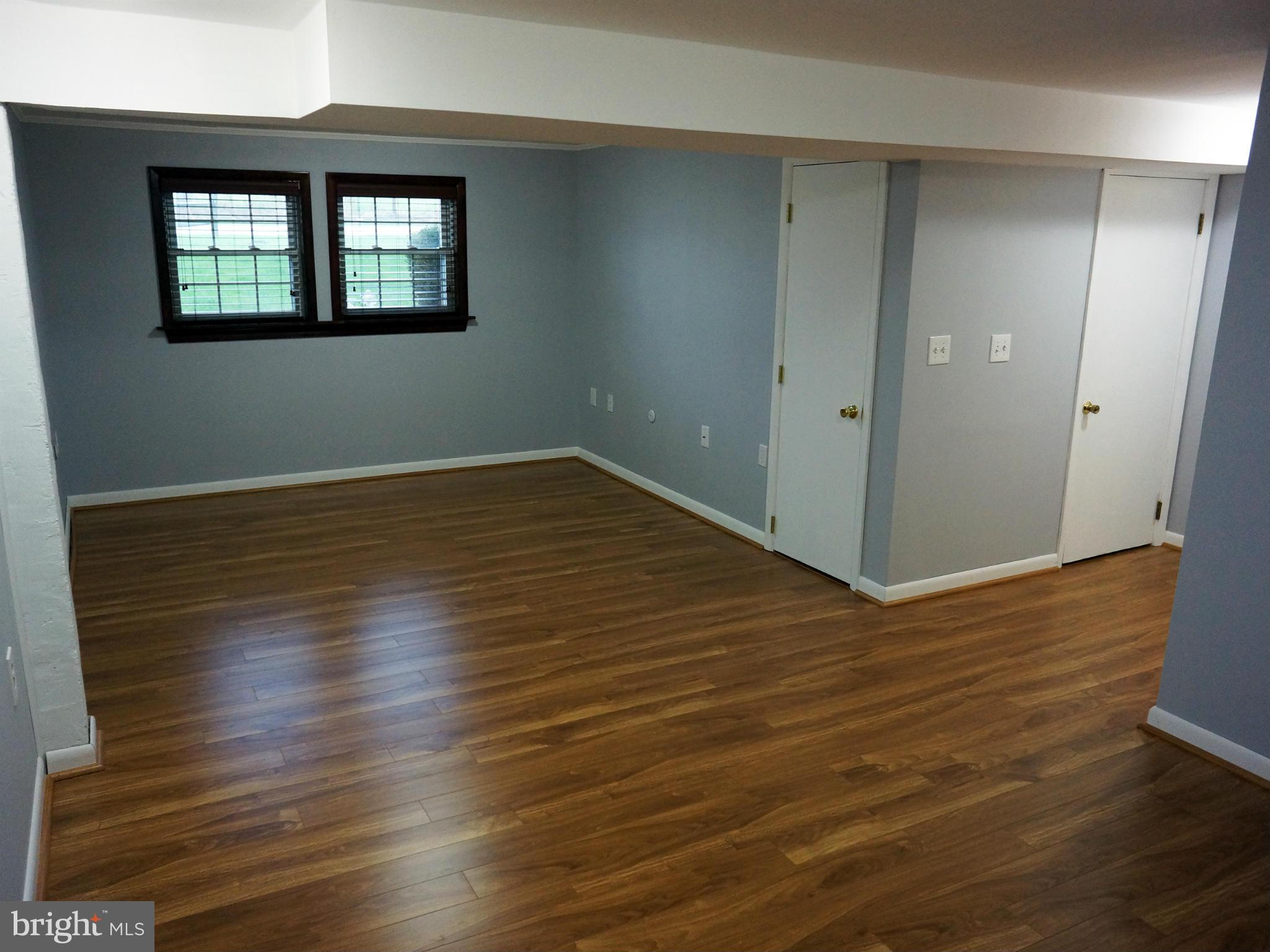 2614 Neudecker Road Westminster, MD 21157 - Photo 21 of 26 an empty room with wooden floor and windows