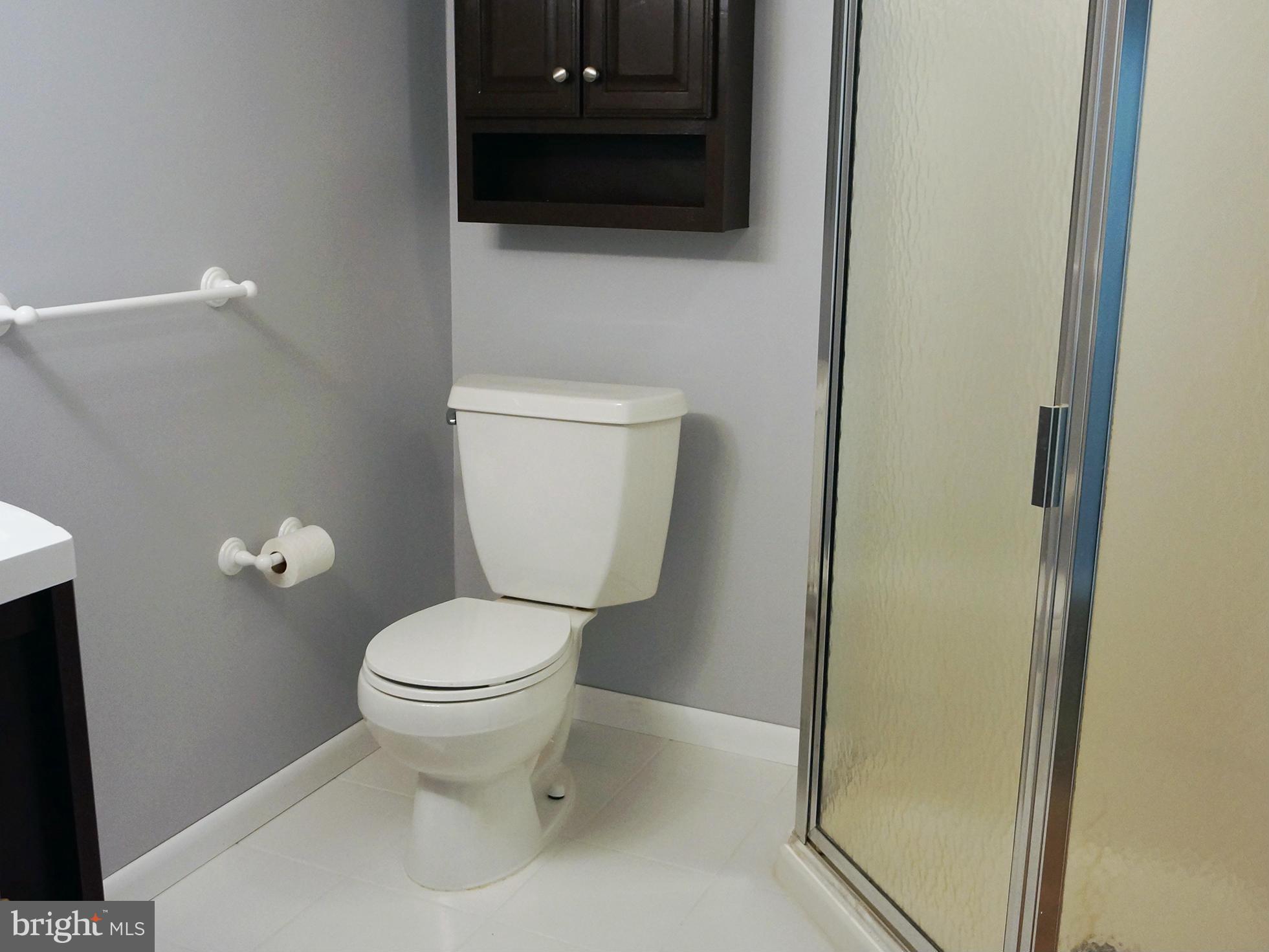 2614 Neudecker Road Westminster, MD 21157 - Photo 23 of 26 a white toilet sitting next to a small bathroom