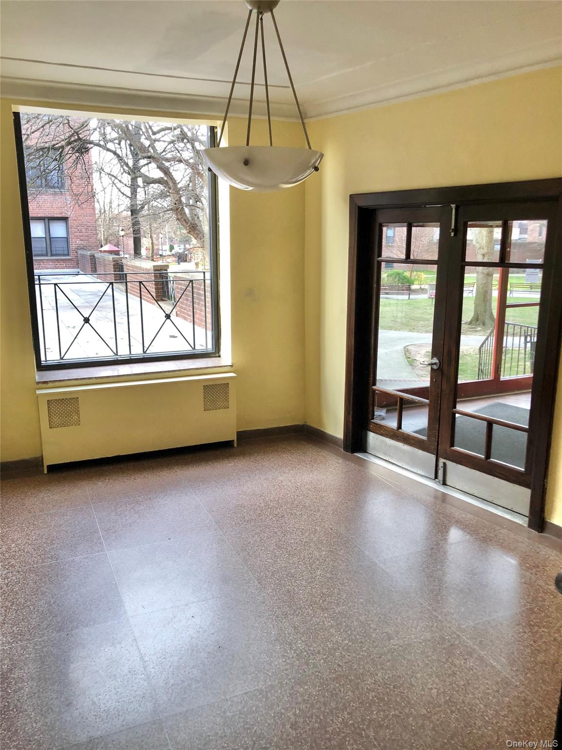 150-25 72nd Road, Unit 1L Queens, NY 11367 - Photo 12 of 12 an empty room with windows and city view
