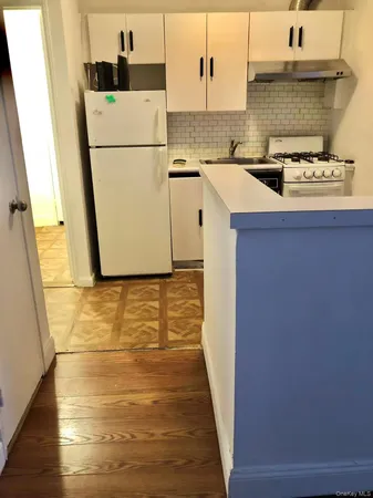 a kitchen with a stove and a sink