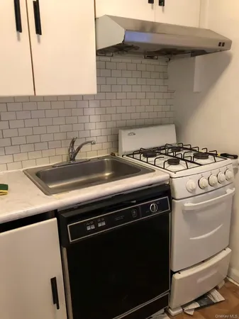 a utility room with washer and dryer