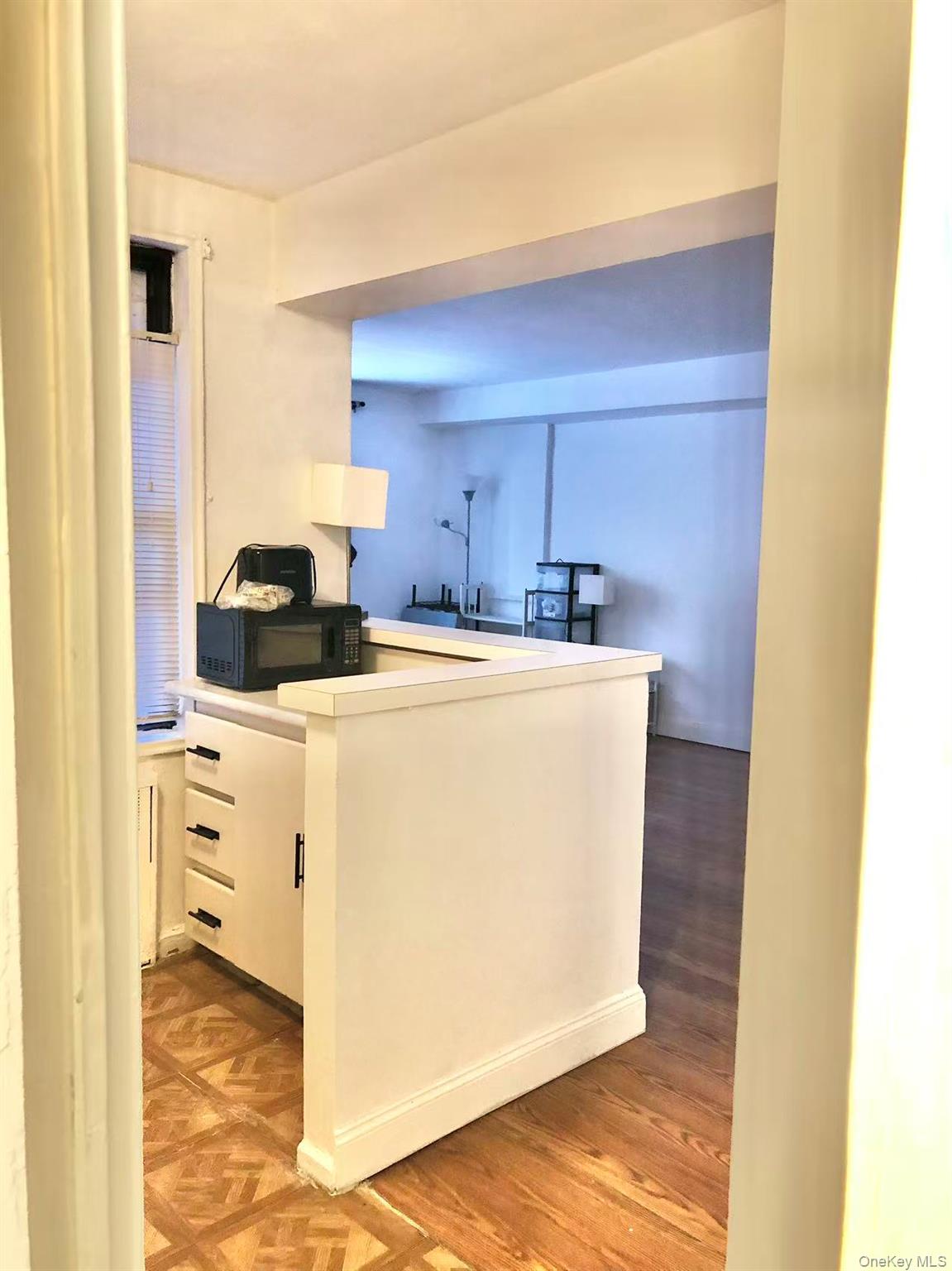 150-25 72nd Road, Unit 1L Queens, NY 11367 - Photo 6 of 12 a utility room with washer and dryer