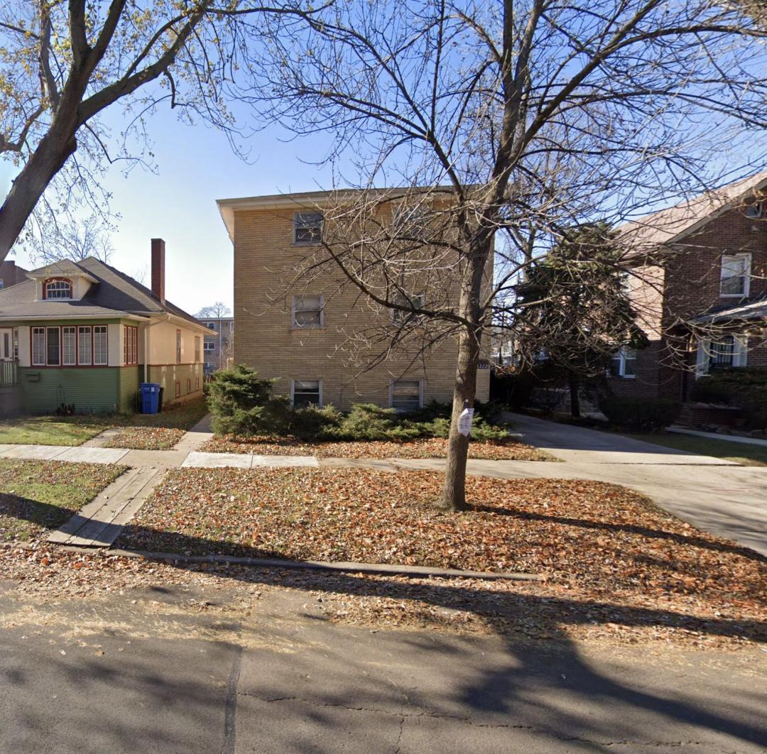 10322 South Wood Street Chicago, IL 60643 - Photo 1 of 1 a view of a house with a yard