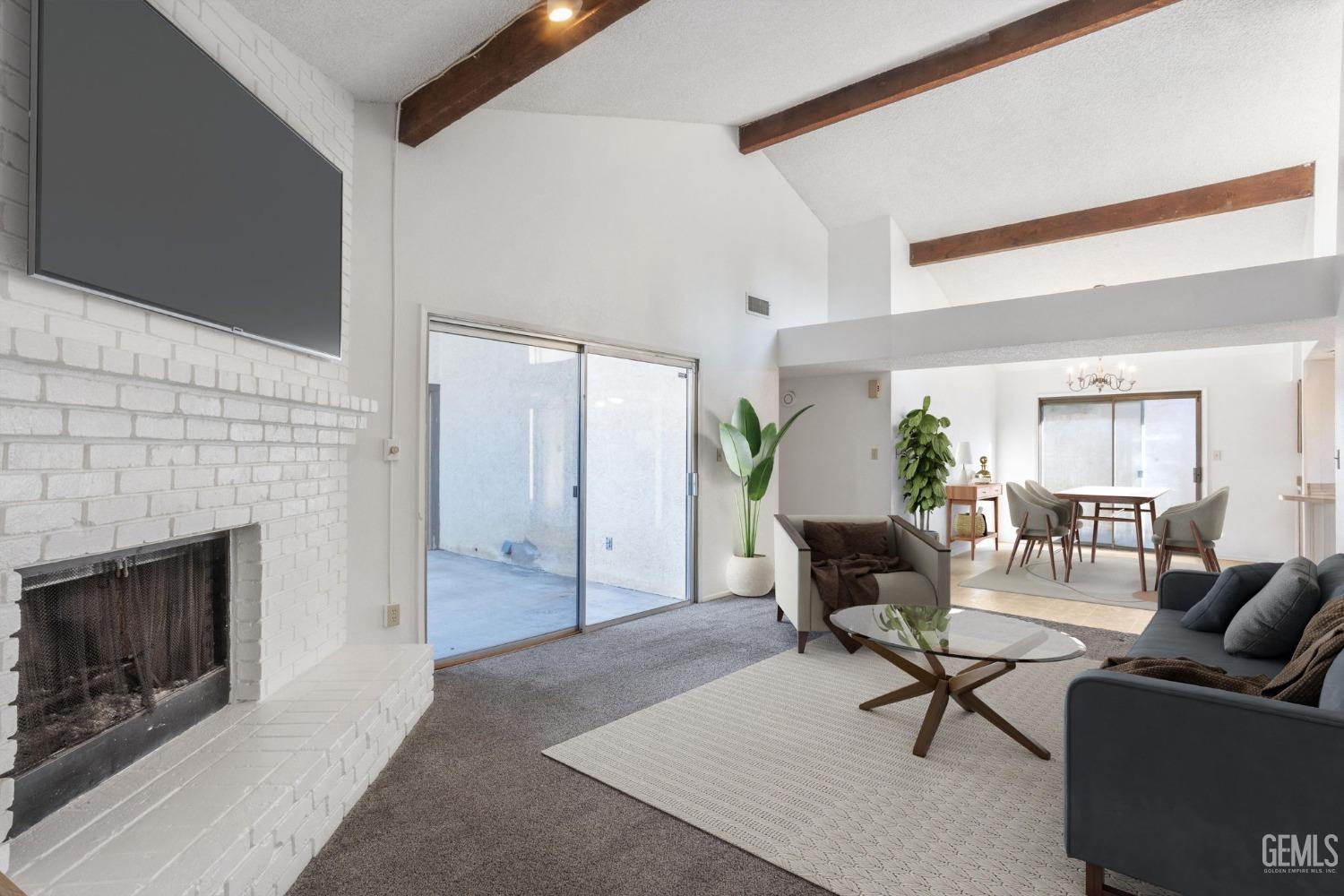 Undisclosed Address Bakersfield, CA 93309 - Photo 15 of 33 a living room with furniture and a fireplace