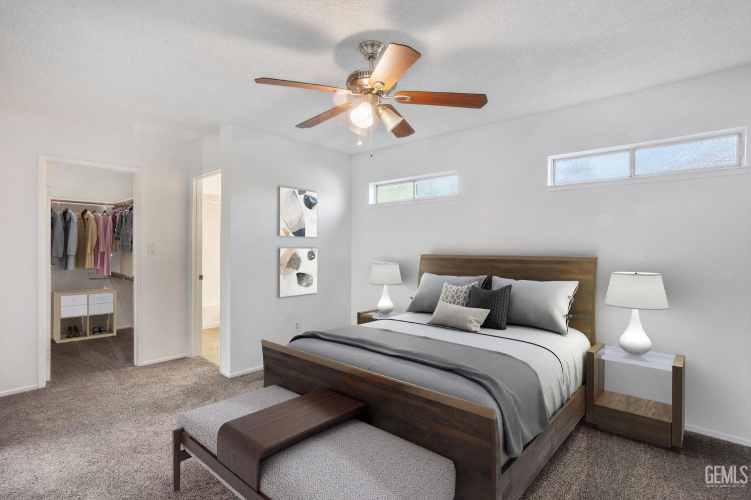 Undisclosed Address Bakersfield, CA 93309 - Photo 18 of 33 a bedroom with a bed and a chandelier