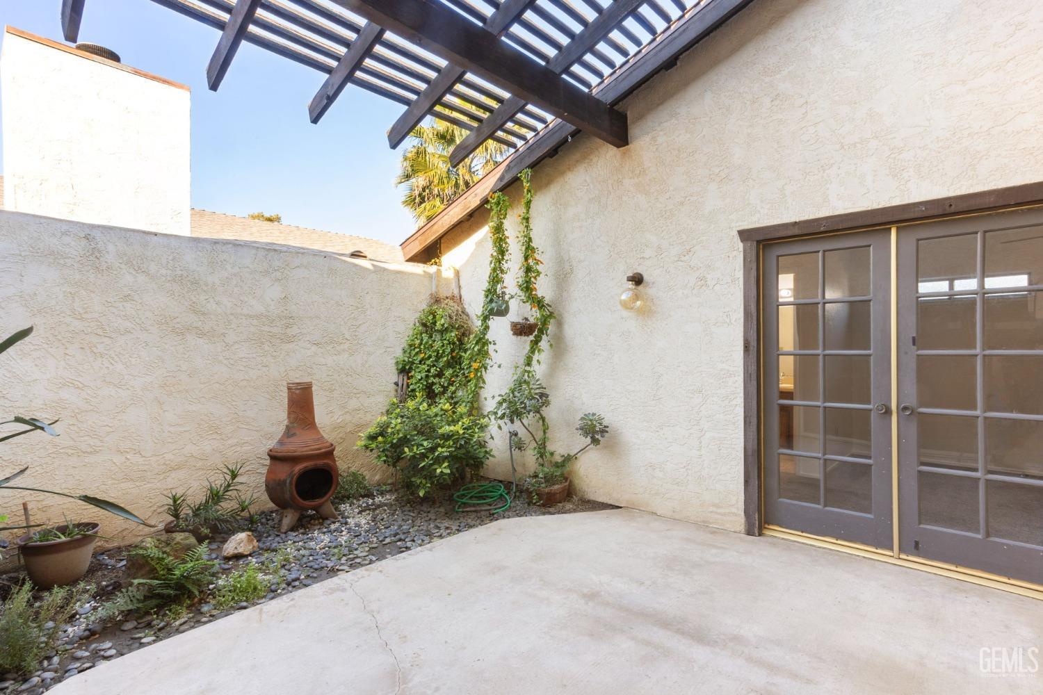 Undisclosed Address Bakersfield, CA 93309 - Photo 20 of 33 a view of a house with potted plants