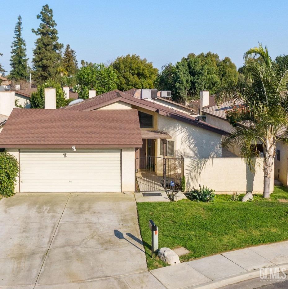 Undisclosed Address Bakersfield, CA 93309 - Photo 2 of 33 a view of a house with a yard