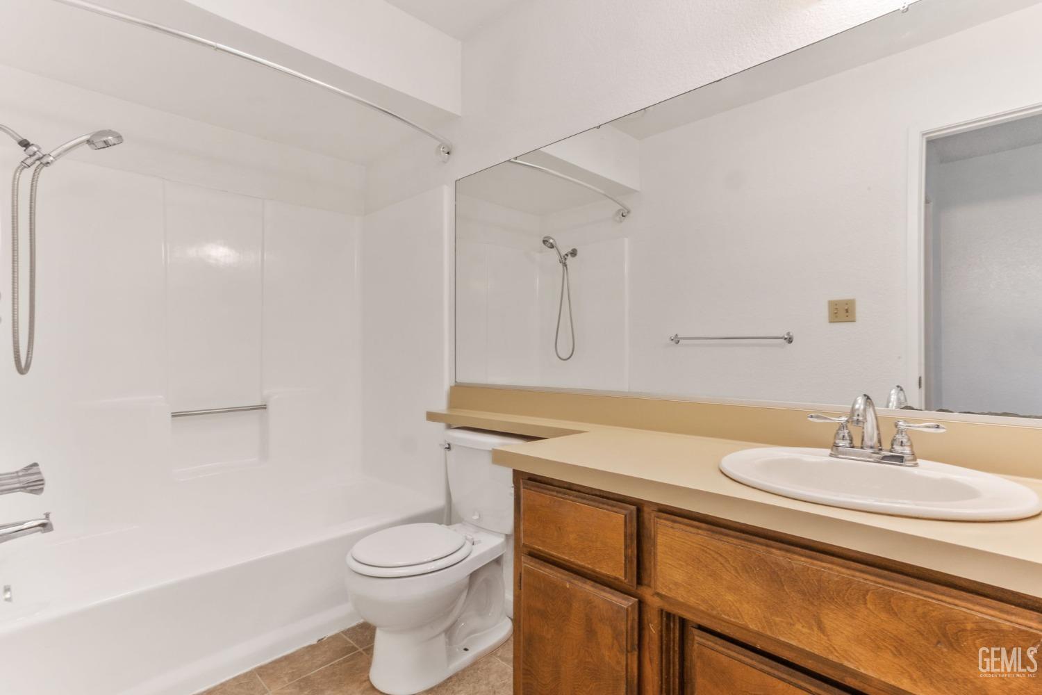 Undisclosed Address Bakersfield, CA 93309 - Photo 21 of 33 a bathroom with a sink toilet and vanity