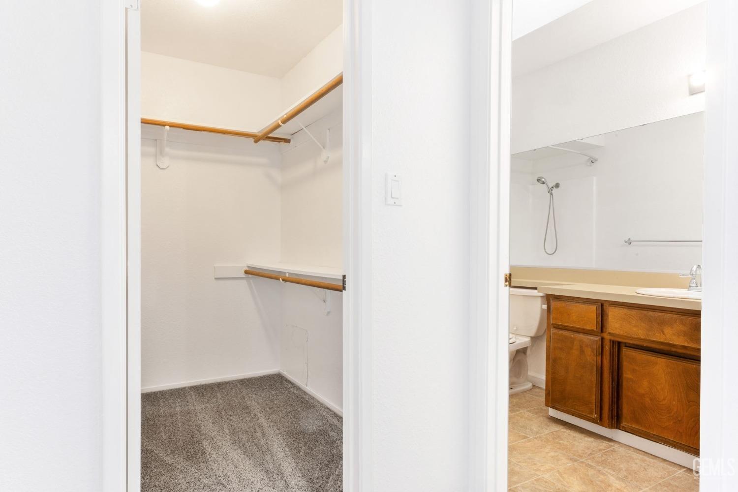 Undisclosed Address Bakersfield, CA 93309 - Photo 22 of 33 a view of walk in closet with cabinet