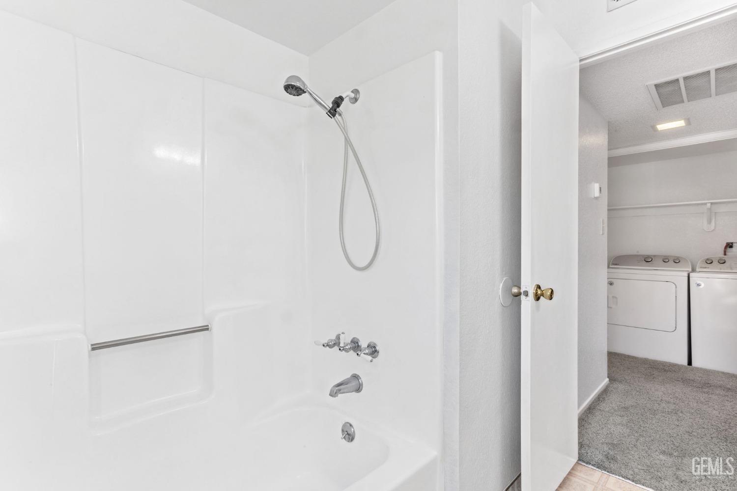 Undisclosed Address Bakersfield, CA 93309 - Photo 25 of 33 a bathroom with a glass shower door